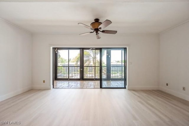 1400 Blue Point Ave Unit 207, Naples, FL 34102 - empty room featuring healthy amount of natural light, wood finished floors, a ceiling fan, and crown molding