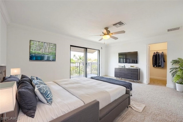 1400 Blue Point Ave Unit 207, Naples, FL 34102 - carpeted bedroom featuring access to outside, crown molding, ceiling fan, and a walk in closet