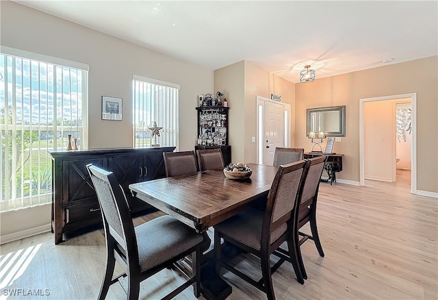 dining room featuring a healthy amount of sunlight and light wood-type flooring