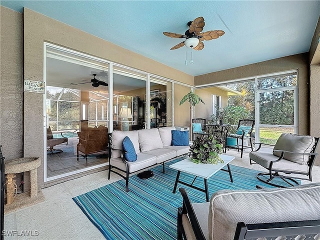 sunroom / solarium with ceiling fan