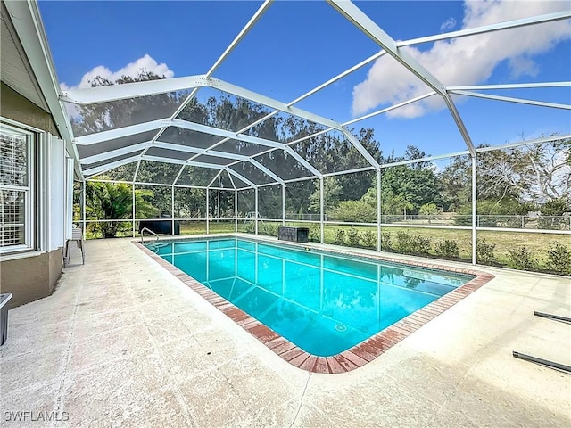 view of pool featuring a lanai and a patio area