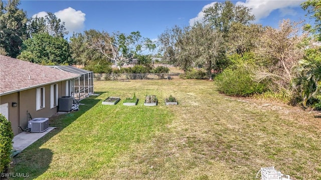 view of yard featuring a lanai and cooling unit