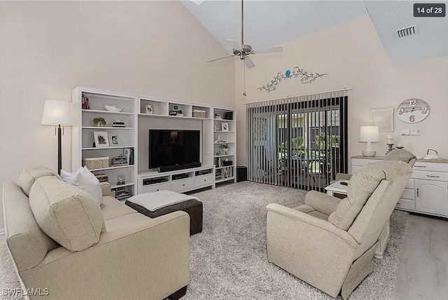 living room featuring high vaulted ceiling and ceiling fan