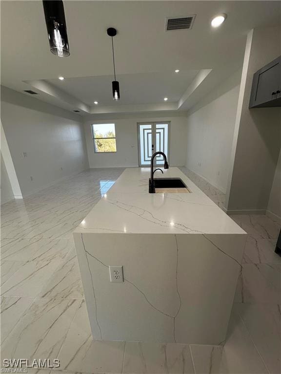 clothes washing area featuring sink