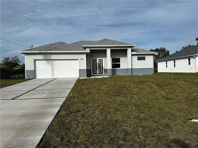 view of front facade featuring a garage and a front yard