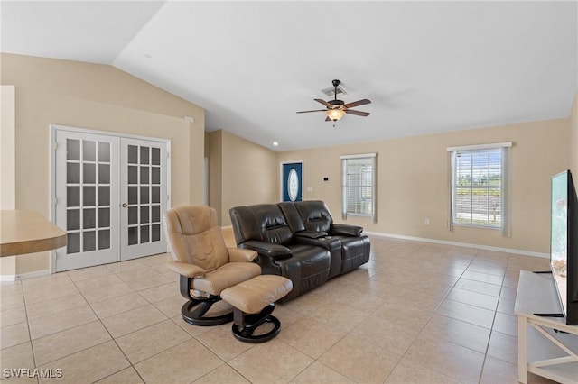 living room with baseboards, light tile patterned flooring, vaulted ceiling, and french doors