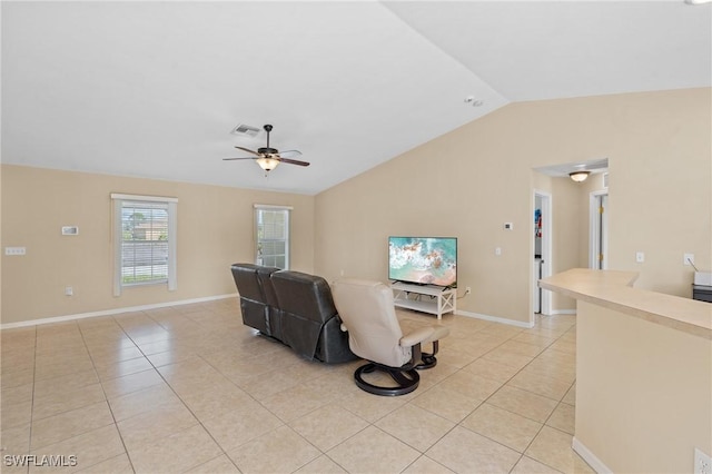 living area featuring lofted ceiling, visible vents, ceiling fan, and light tile patterned floors