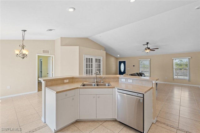 kitchen with a sink, visible vents, open floor plan, and stainless steel dishwasher