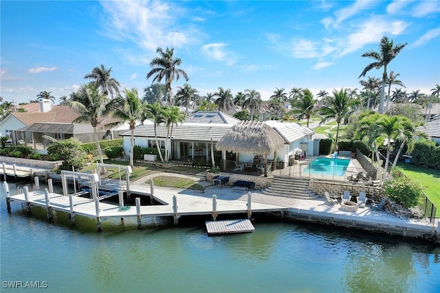 rear view of house featuring a water view