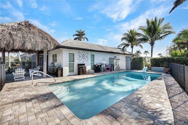 view of swimming pool featuring a patio