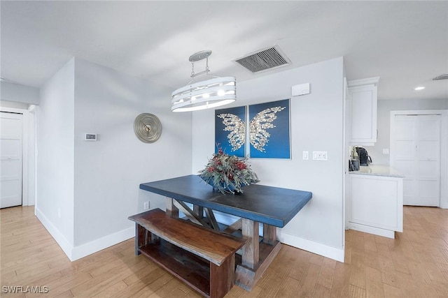 dining space featuring light hardwood / wood-style flooring