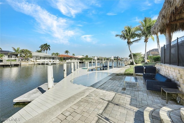 view of pool featuring a water view and a dock