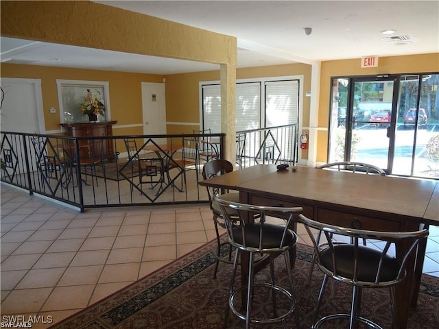 dining room featuring tile patterned flooring