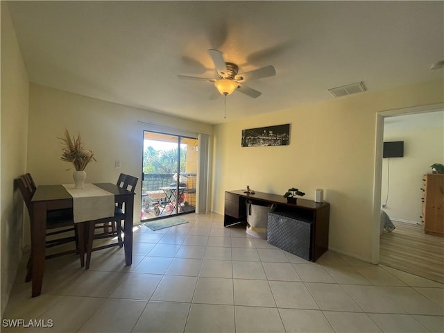 office area featuring light tile patterned flooring and ceiling fan