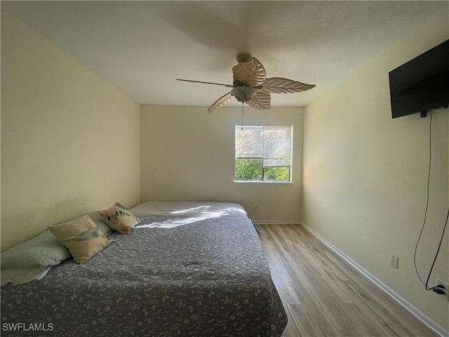 unfurnished bedroom with ceiling fan and light hardwood / wood-style floors