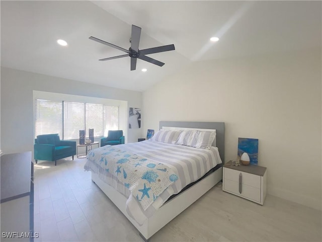 bedroom featuring ceiling fan, lofted ceiling, and light hardwood / wood-style floors