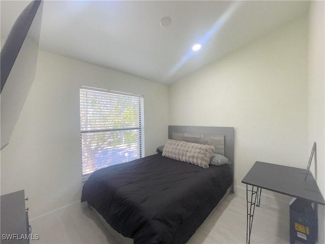 bedroom with lofted ceiling