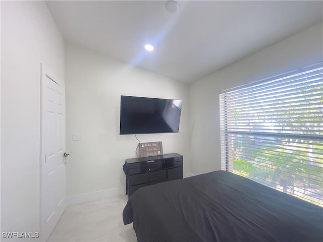 bedroom with lofted ceiling