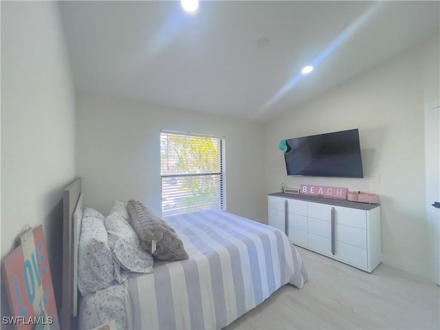 bedroom with lofted ceiling