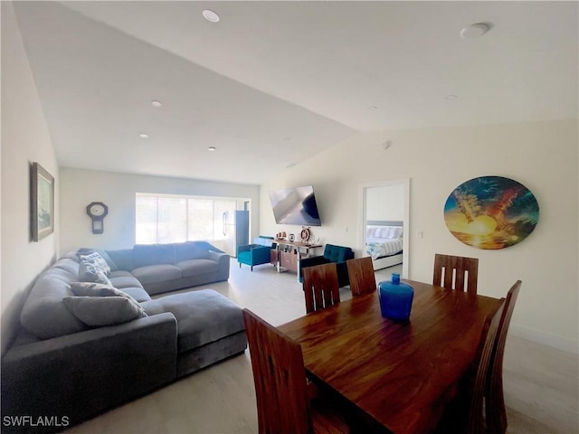 dining room with vaulted ceiling