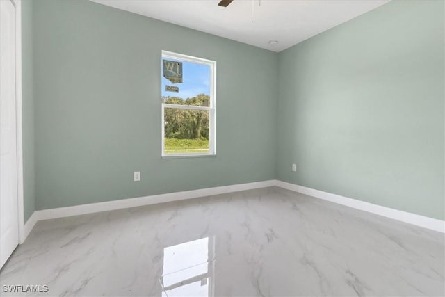 unfurnished room with ceiling fan