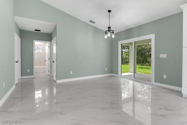 empty room with an inviting chandelier