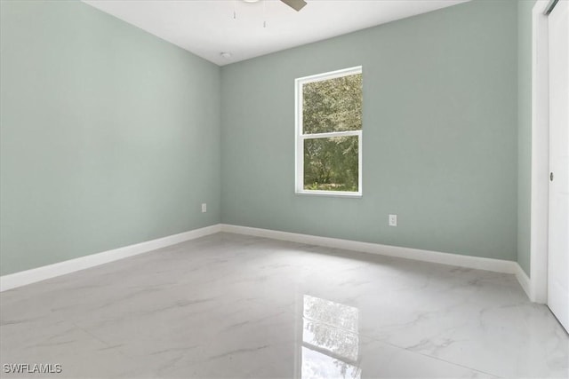 unfurnished room with ceiling fan