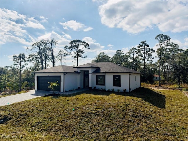 view of front facade featuring a garage and a front yard