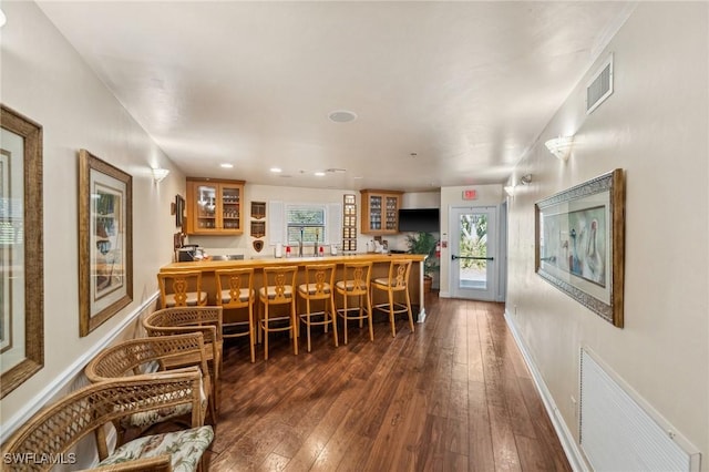 15197 Storrington Pl Unit C101, Naples, FL 34110 - dining room with baseboards, dark wood-style floors, and visible vents
