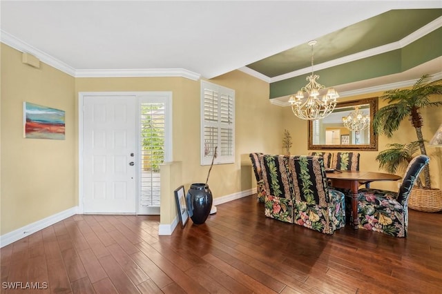 15197 Storrington Pl Unit C101, Naples, FL 34110 - dining area featuring crown molding, baseboards, wood finished floors, and a chandelier