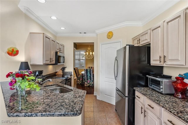 kitchen with crown molding, stainless steel appliances, light tile patterned flooring, and sink