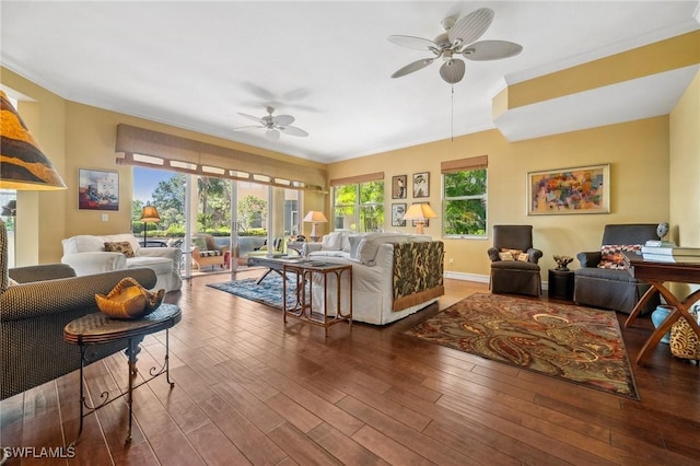 living room featuring crown molding, dark hardwood / wood-style floors, and ceiling fan