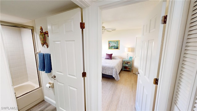 hallway with light hardwood / wood-style floors