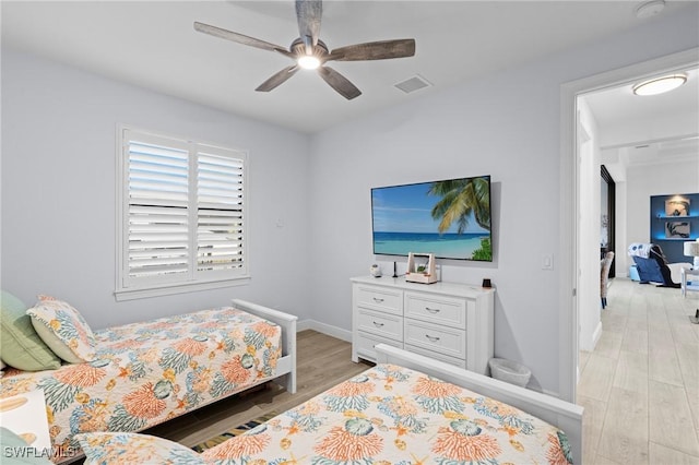 bedroom featuring light hardwood / wood-style floors and ceiling fan