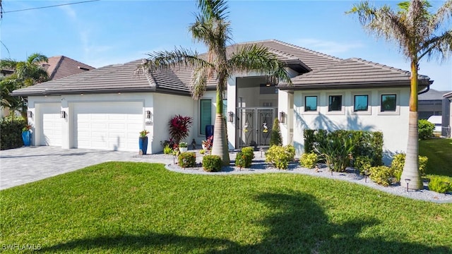 view of front of house with a garage and a front yard