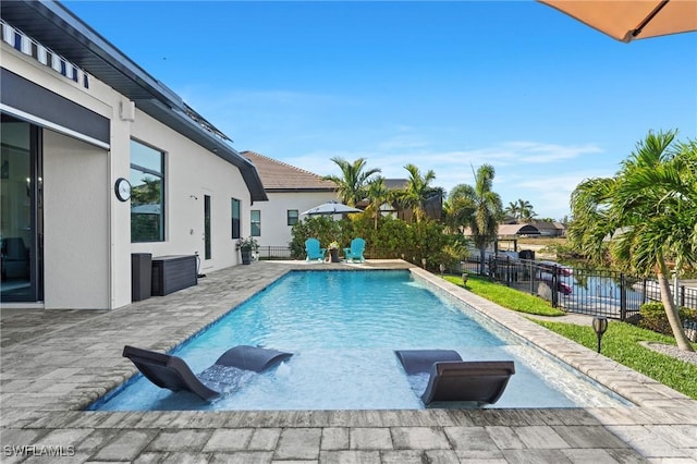 view of pool featuring a patio