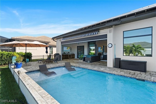 rear view of house with an outdoor hangout area