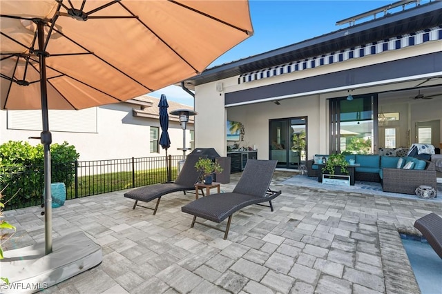 view of patio featuring an outdoor hangout area and ceiling fan