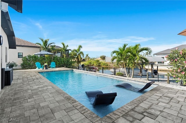 view of swimming pool with a patio area