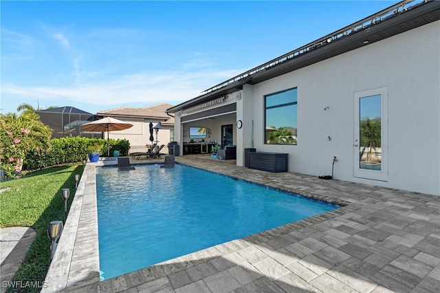 view of swimming pool featuring a patio