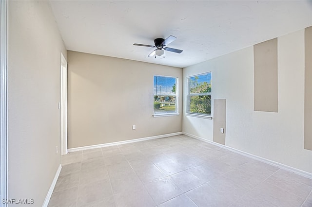 unfurnished room with ceiling fan