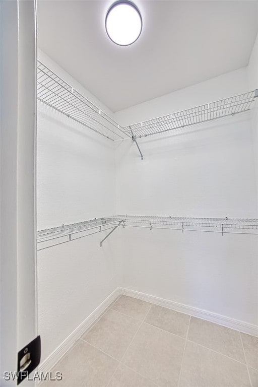 spacious closet with tile patterned flooring