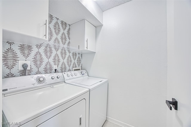 laundry area with cabinets and independent washer and dryer