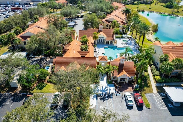 birds eye view of property with a water view