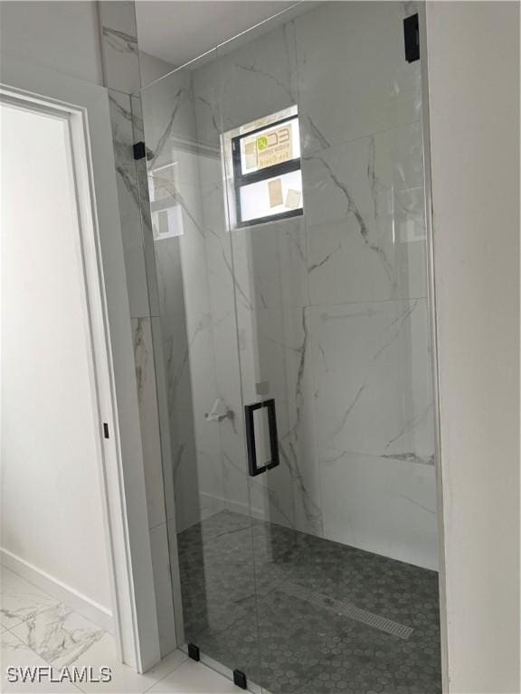 bathroom featuring an enclosed shower