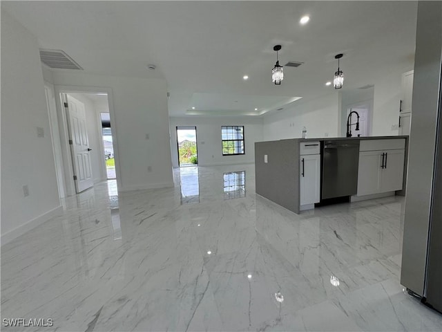 kitchen featuring white cabinets, decorative light fixtures, and dishwasher