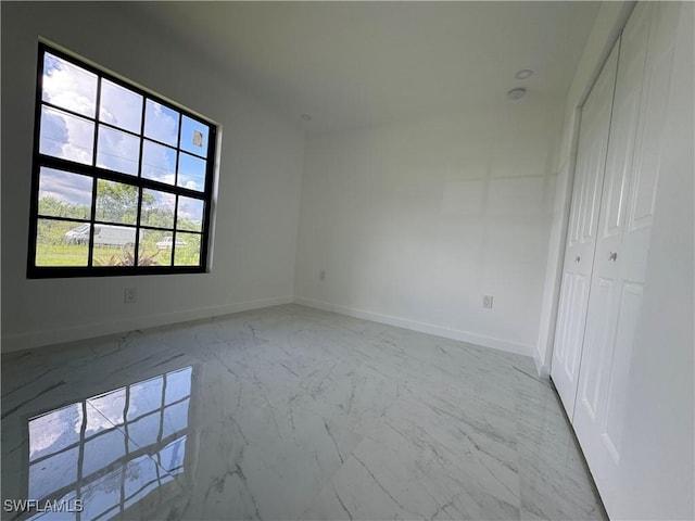 unfurnished bedroom featuring a closet