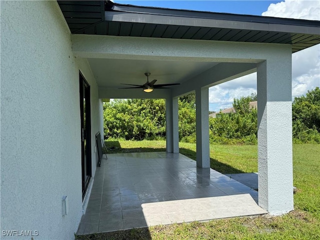 view of patio featuring ceiling fan