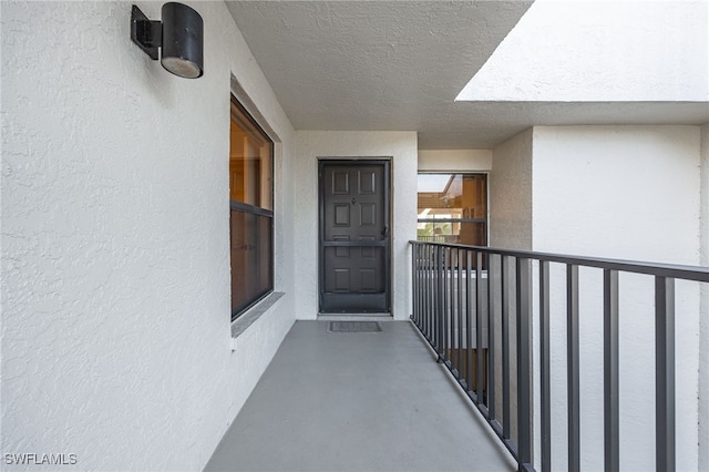 doorway to property featuring a balcony