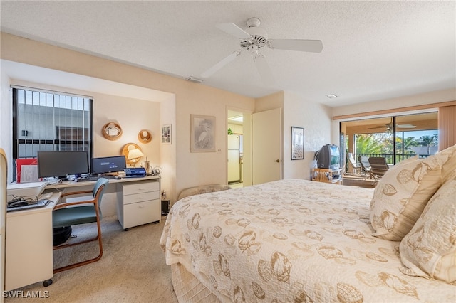 bedroom featuring white fridge, access to exterior, ceiling fan, light carpet, and a textured ceiling